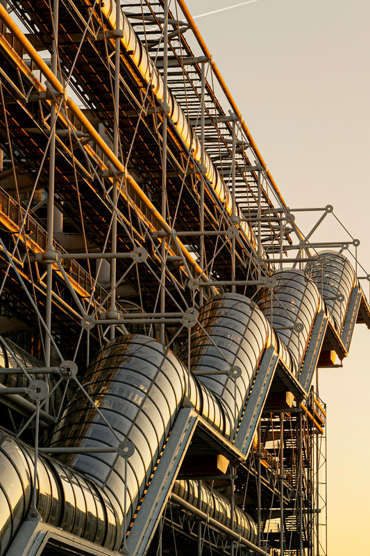 Modern building exterior with glass tubes and metal structure